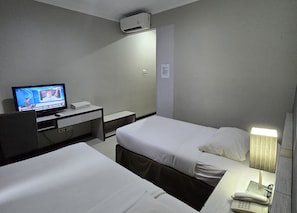Desk, laptop workspace, blackout curtains, bed sheets