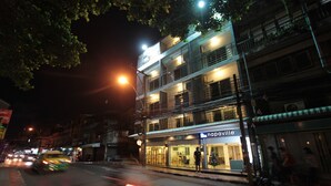 A multi-story building with a storefront labeled "napaville."