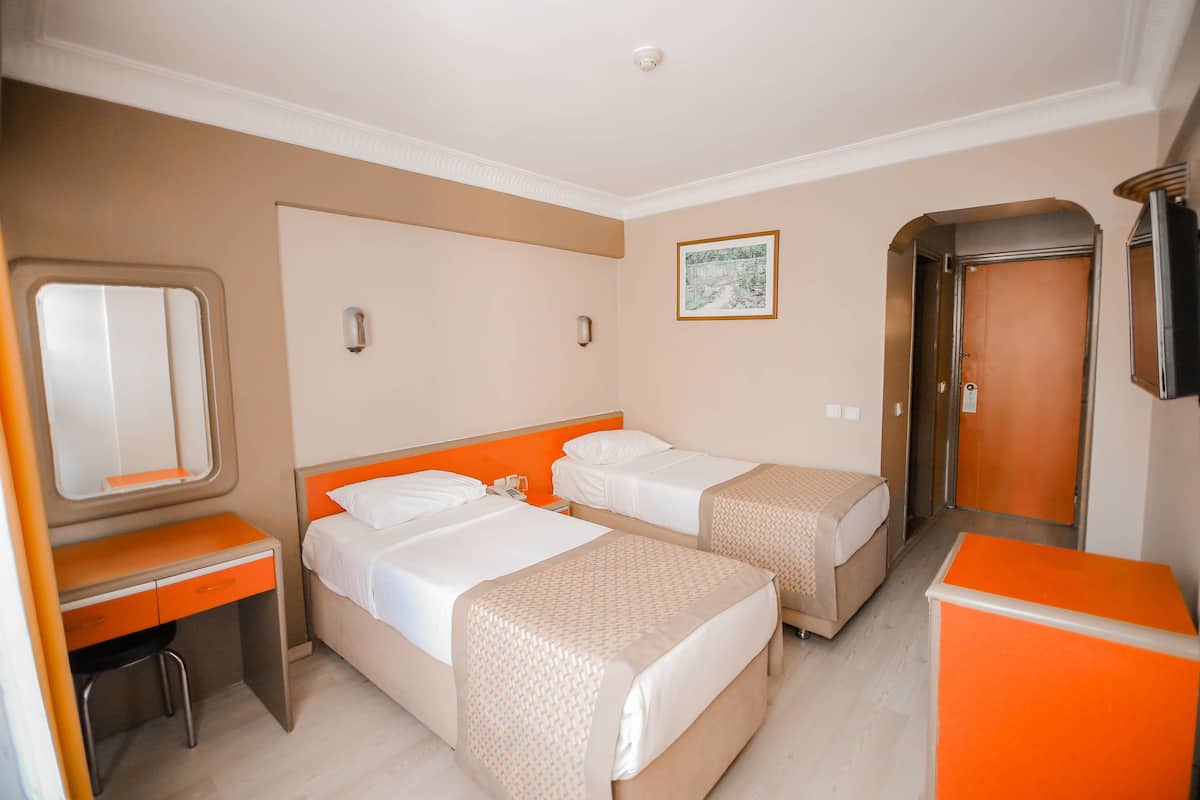 Luxe beddengoed, een minibar, een bureau, gratis wifi