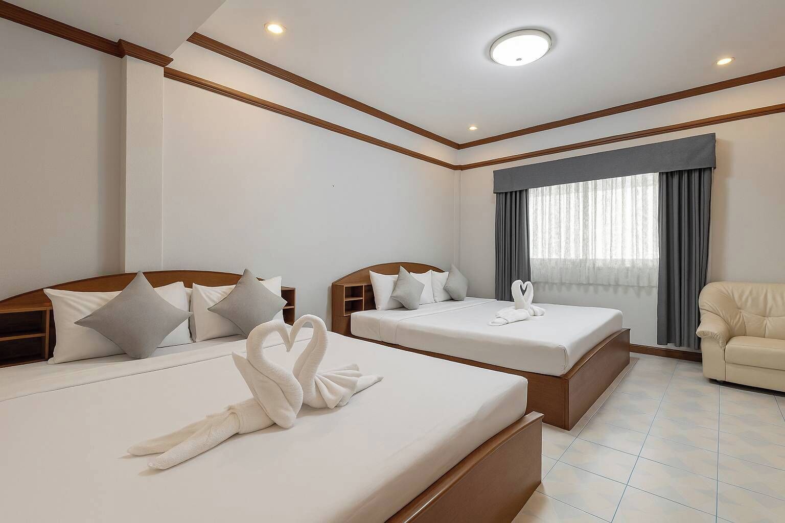 Family Room | Free minibar, in-room safe, individually decorated, desk