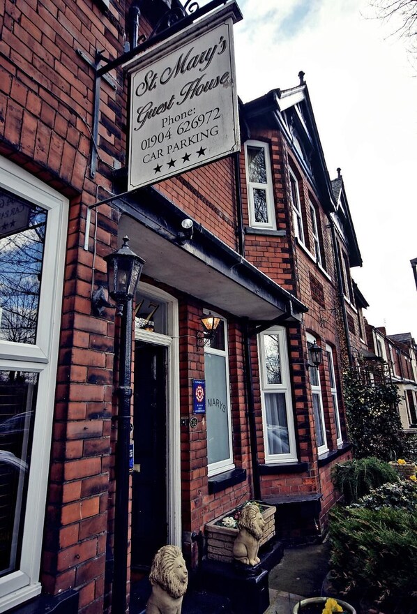 A brick building with a sign for 'St. Mary's Guest House' and a phone number. - St Mary's Guest House  (York)