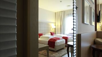 Twin Room | Minibar, in-room safe, desk, soundproofing