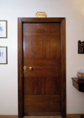 A wooden door with a brass nameplate reading 'Piccadero.' - Residenza delle Arti (Rome)