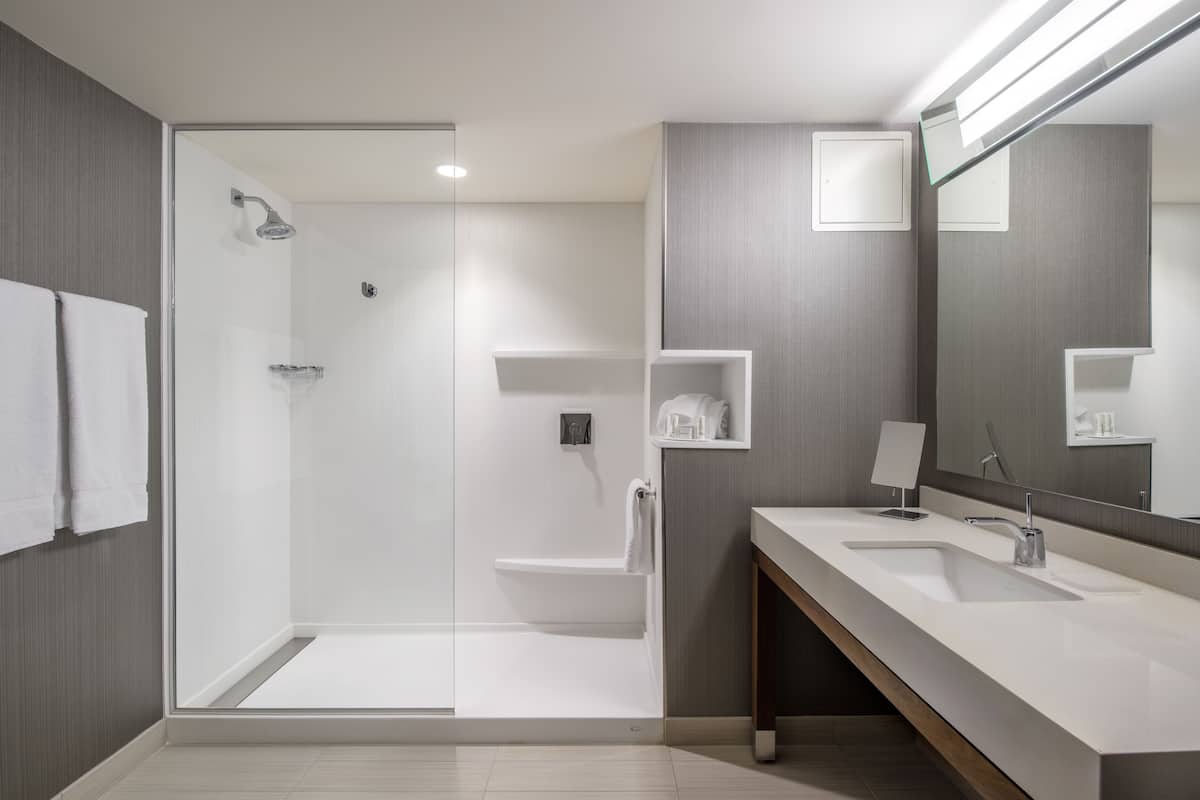 shower, eco-friendly toiletries, hair dryer, towels