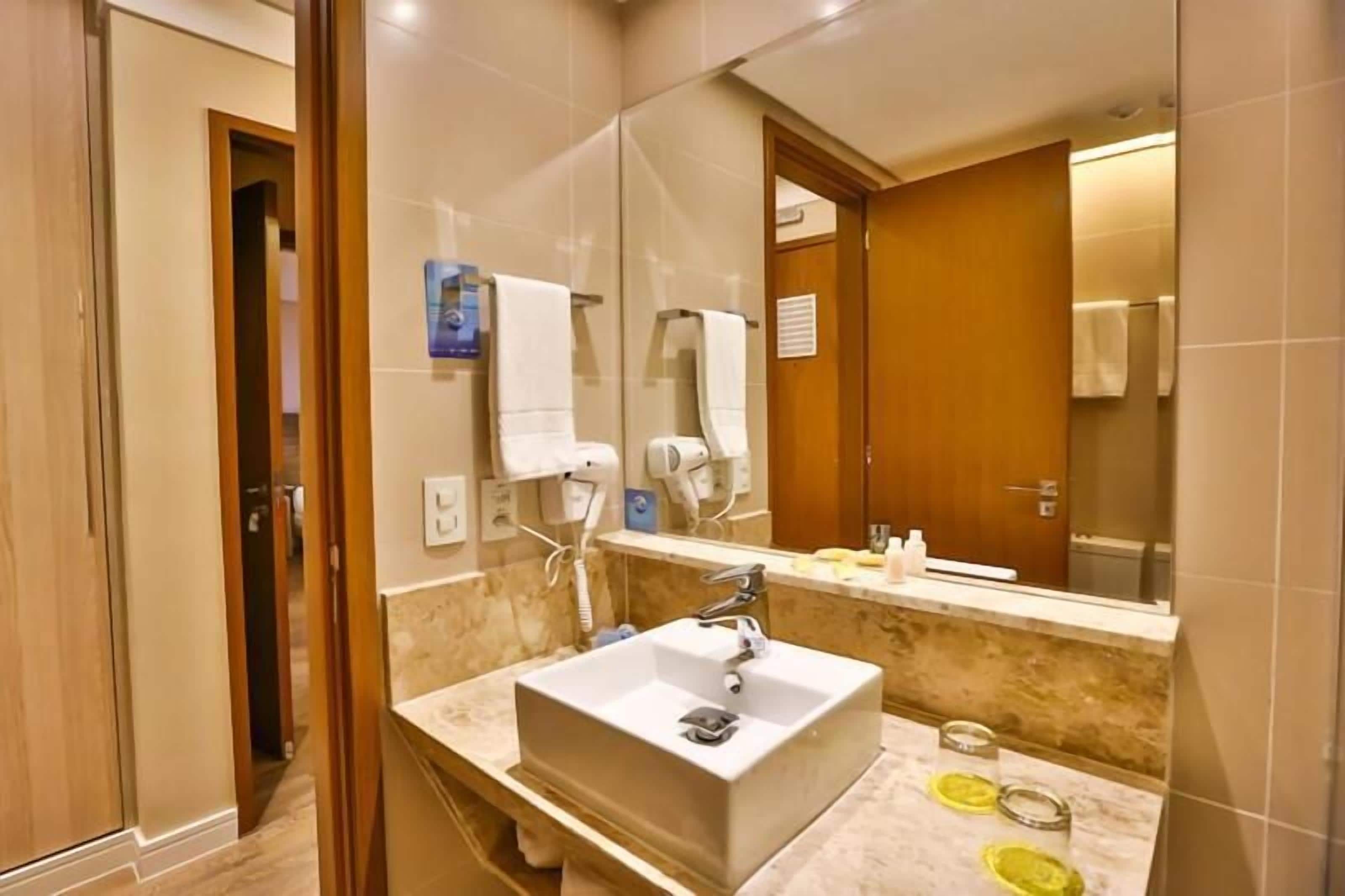 superior double room | bathroom | shower, free toiletries, hair dryer, towels