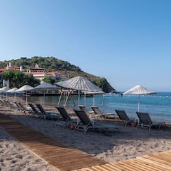 On the beach, sun-loungers, beach umbrellas, beach towels