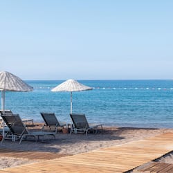 On the beach, sun loungers, beach umbrellas, beach towels