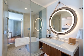 Deluxe Room, 1 King Bed, Ocean View | Bathroom | Designer toiletries, hair dryer, towels, soap at Hyatt Centric Waikiki Beach