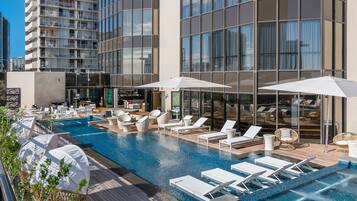 Outdoor pool, open 6:00 AM to 10:00 PM, free cabanas, pool umbrellas