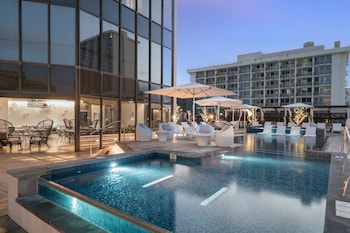 Outdoor pool, open 6:00 AM to 10:00 PM, free cabanas, pool umbrellas at Hyatt Centric Waikiki Beach