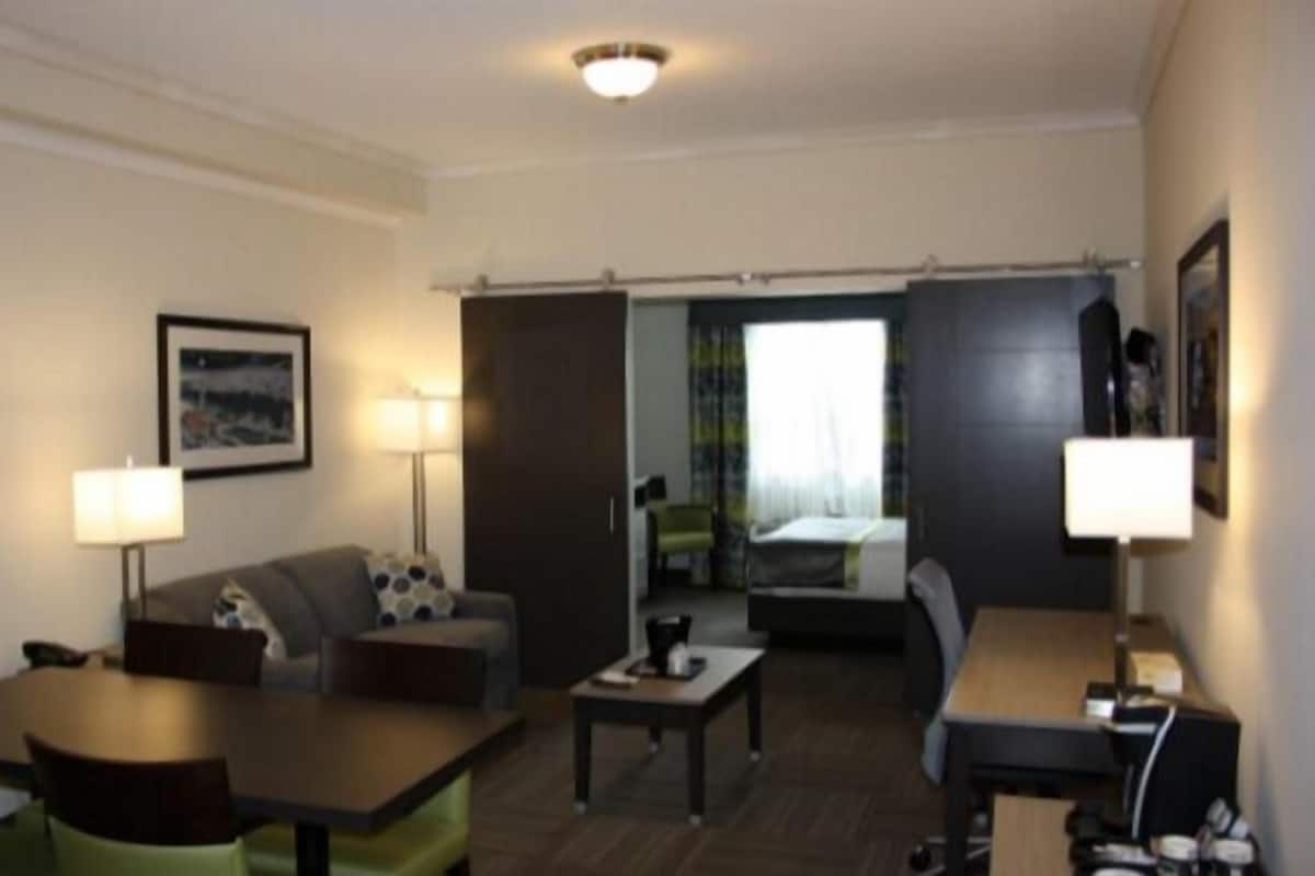 Suite, 1 Bedroom, Kitchenette (Not Pet Friendly) | Living area | 32-inch flat-screen TV with cable channels, TV