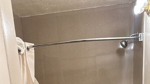 A bathroom with a bathtub, a shower, and a toilet. - Deluxe Inn Of Roswell (Roswell)