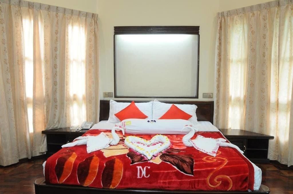 Minibar, desk, blackout drapes, iron/ironing board