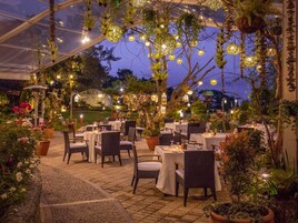 Breakfast, lunch, dinner served; international cuisine, garden views 