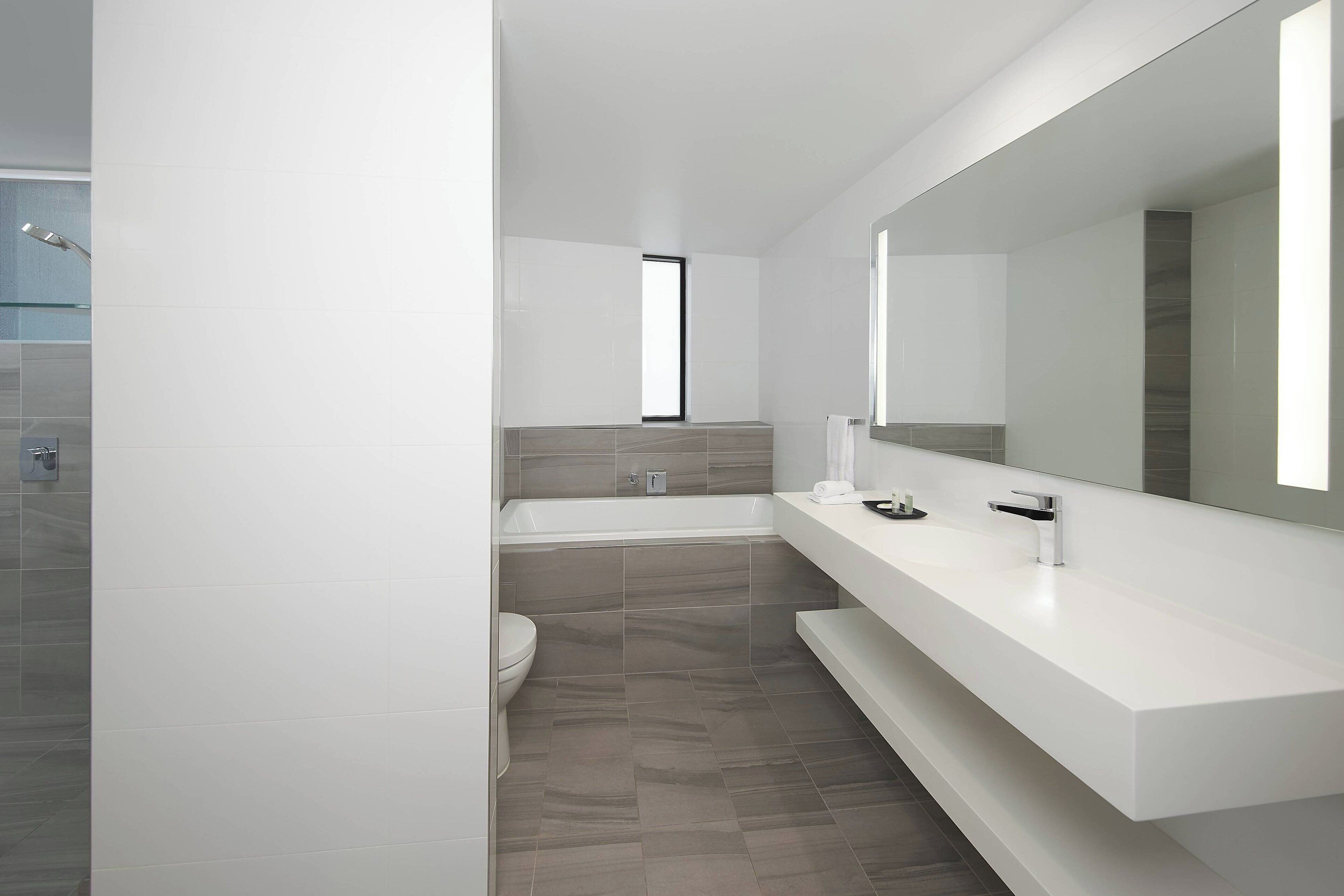 premium suite, 1 king bed, non smoking, balcony | bathroom | free toiletries, hair dryer, bathrobes, slippers