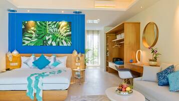 A modern hotel room with a large bed, a desk, a sofa, and a dining table.