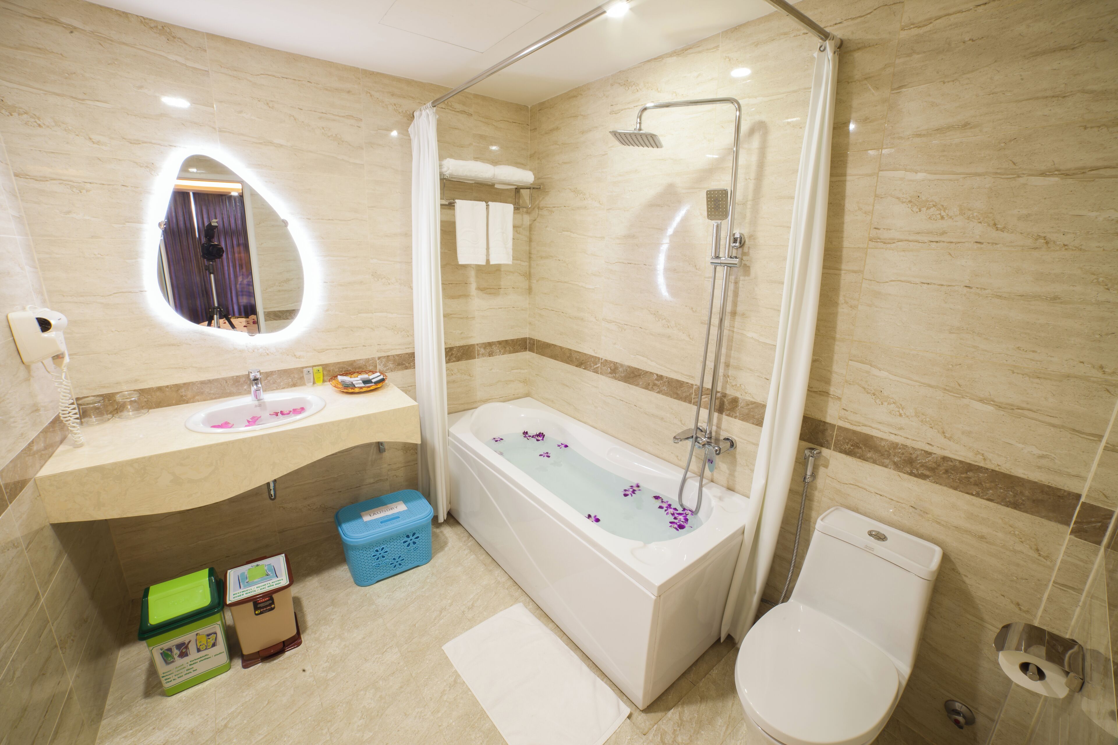 eco-friendly toiletries, hair dryer, bathrobes, slippers