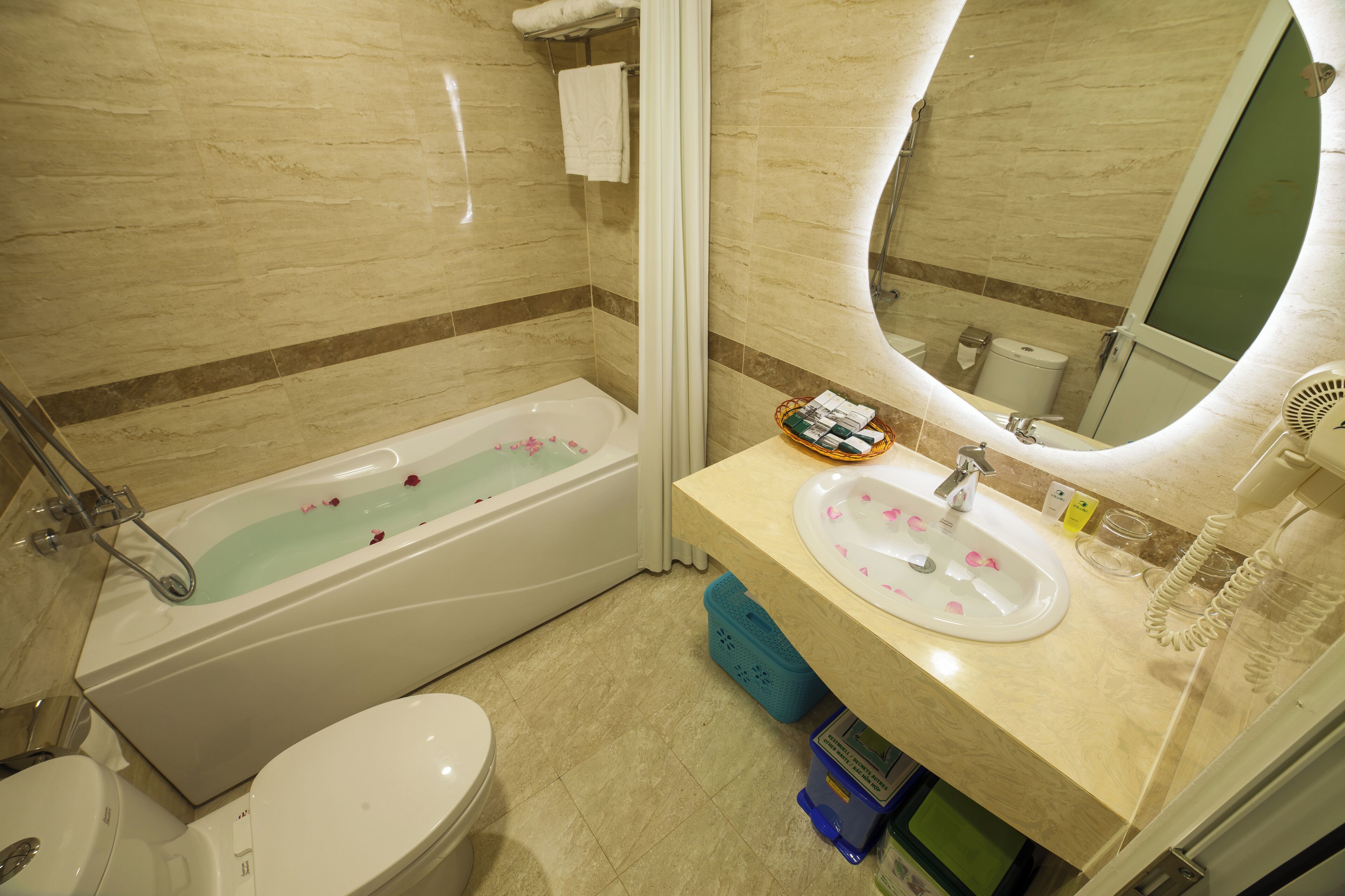 eco-friendly toiletries, hair dryer, bathrobes, slippers