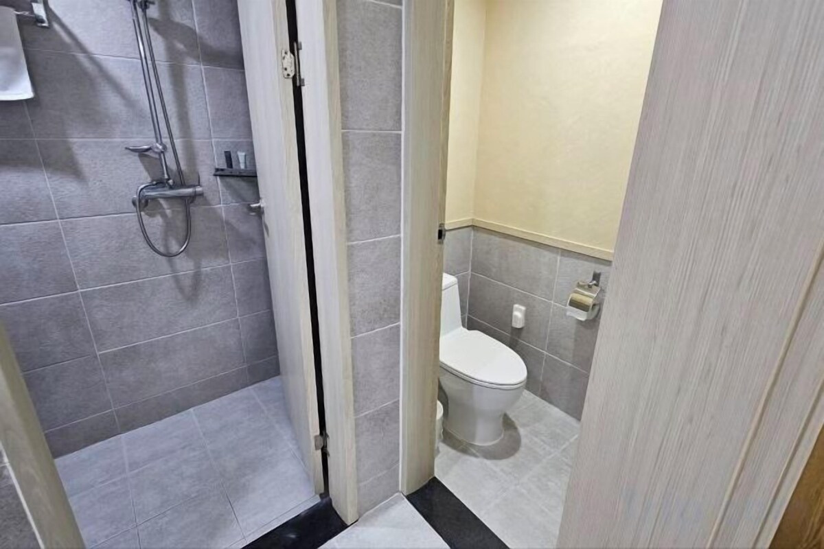 Bathroom | Shower, hair dryer, slippers, towels
