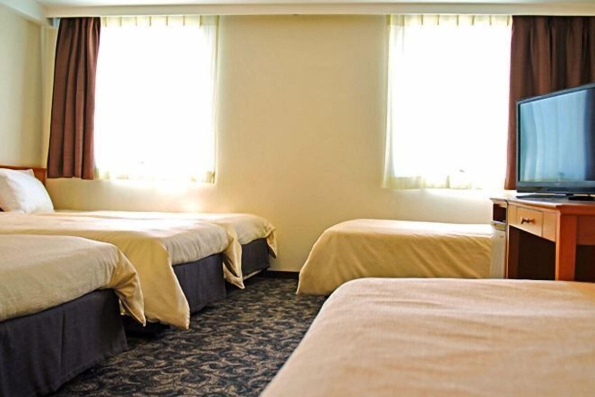 Desk, blackout drapes, bed sheets