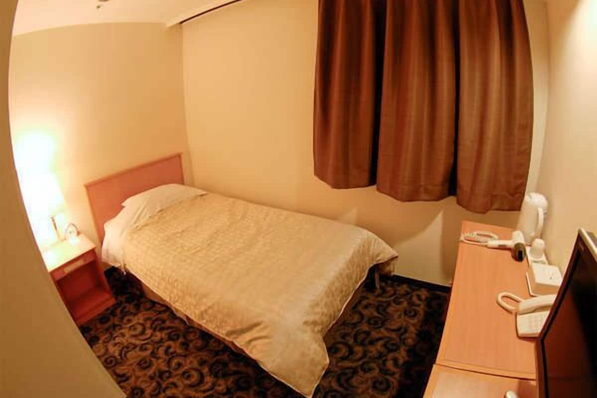 Desk, blackout curtains, free wired Internet, bed sheets