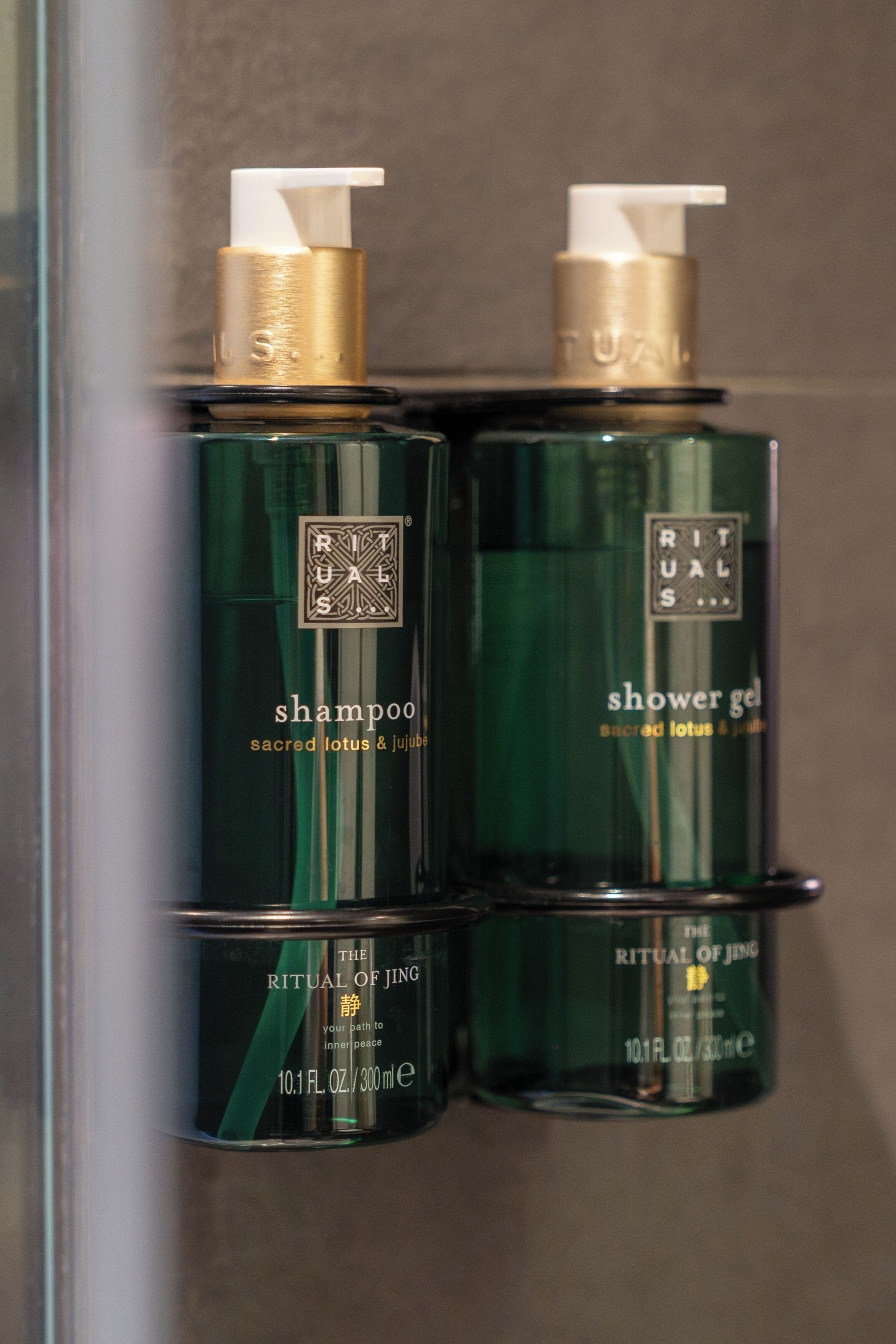 Two bottles of Ritual of Jing shampoo and shower gel.