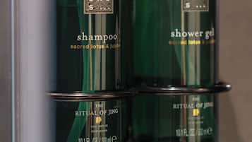 Two bottles of Ritual of Jing shampoo and shower gel.