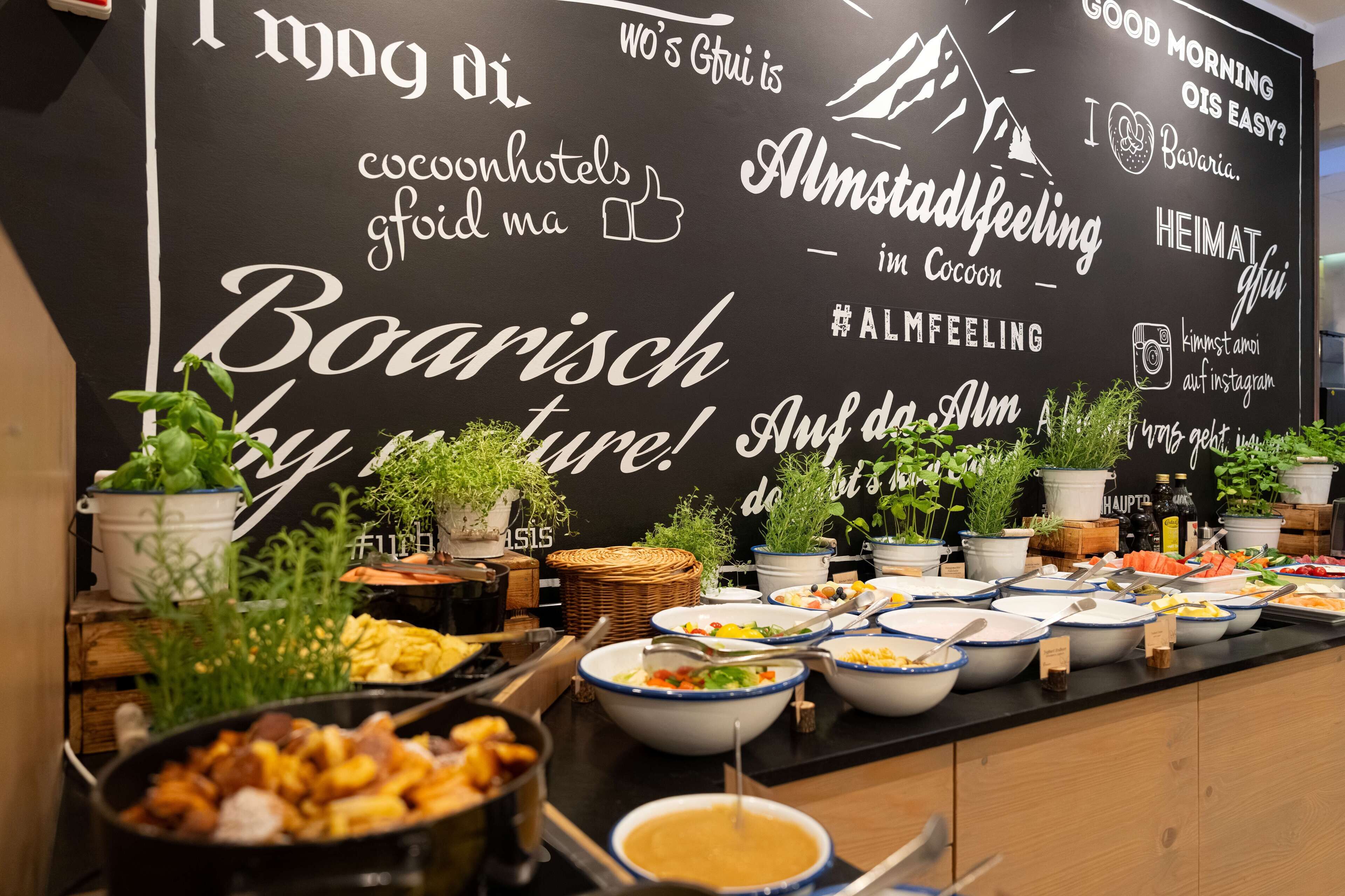 A buffet with various dishes and a blackboard with travel-related phrases.