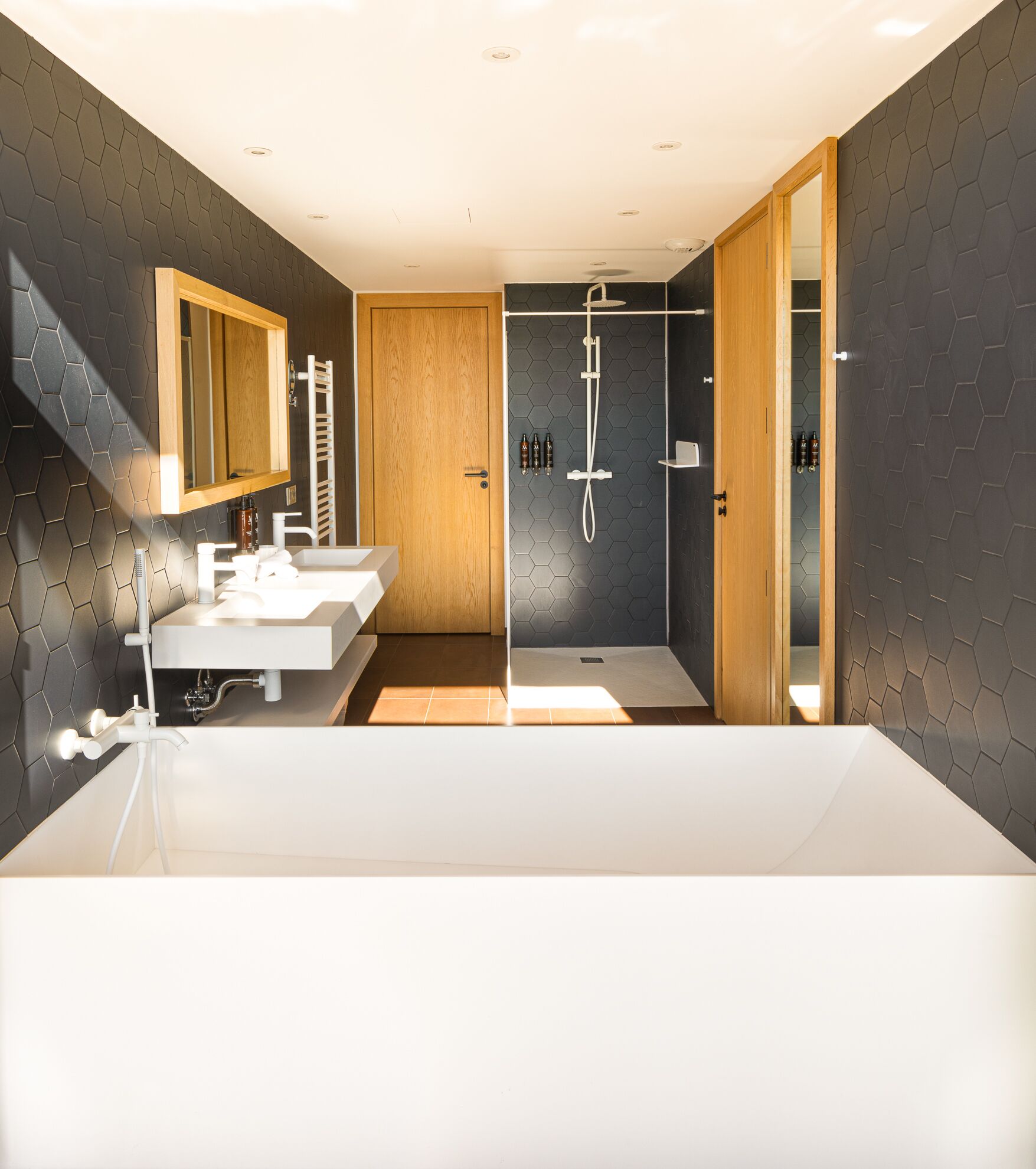 grand suite (citadelle view) | bathroom | shower, designer toiletries, hair dryer, bathrobes