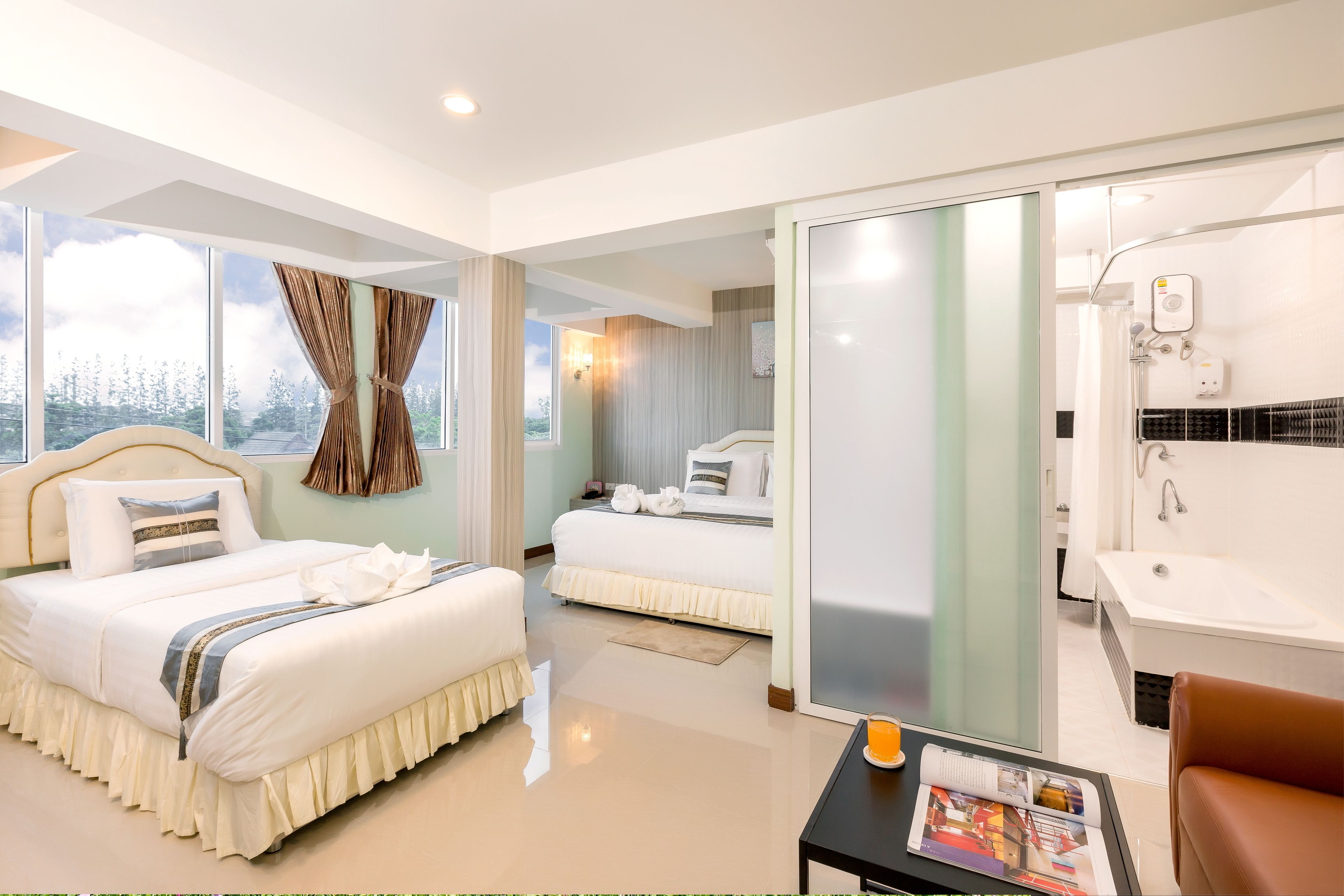 family suite room with bathtub | desk, laptop workspace, blackout curtains, free wifi