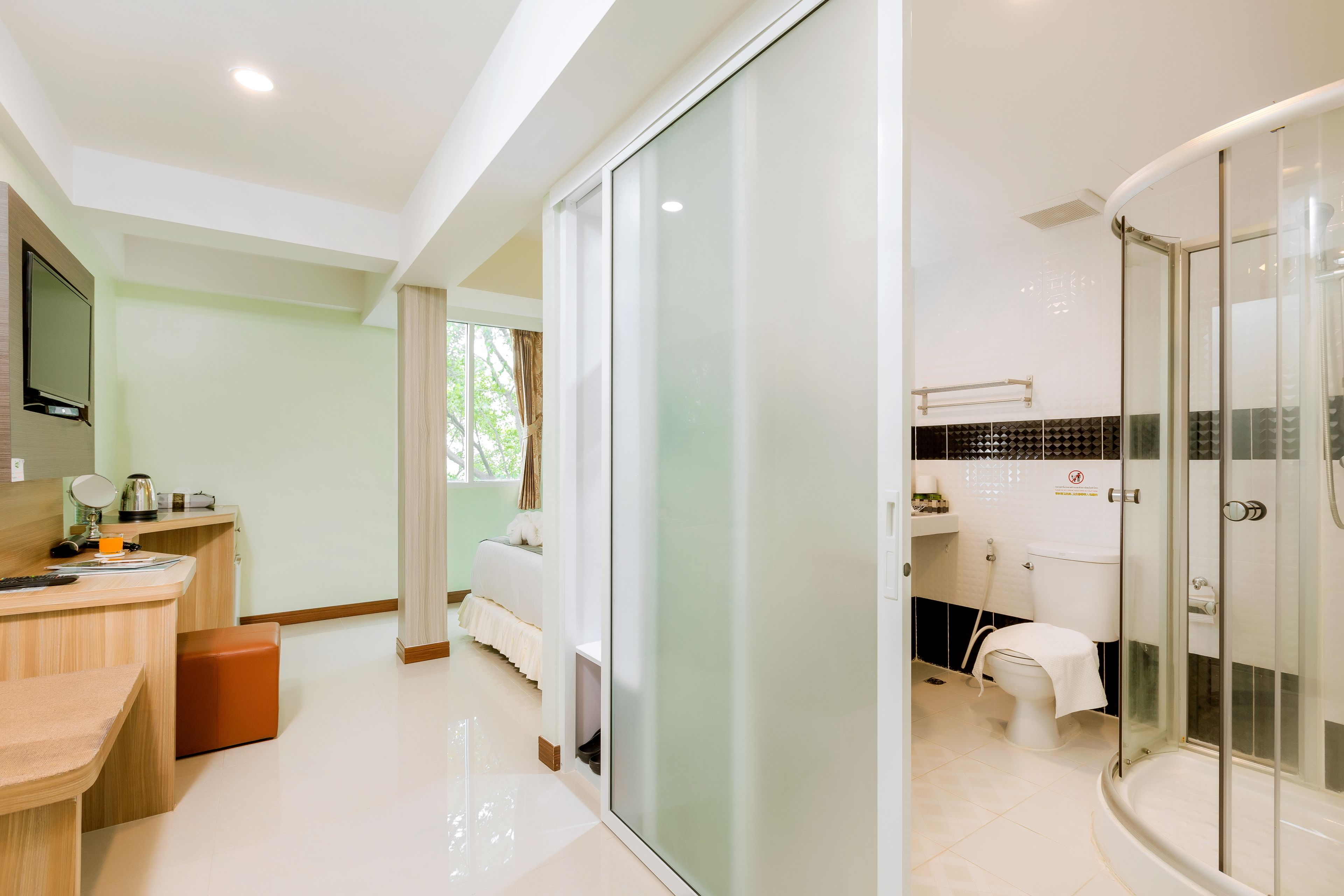 deluxe double room | bathroom | shower, rainfall showerhead, hair dryer, towels