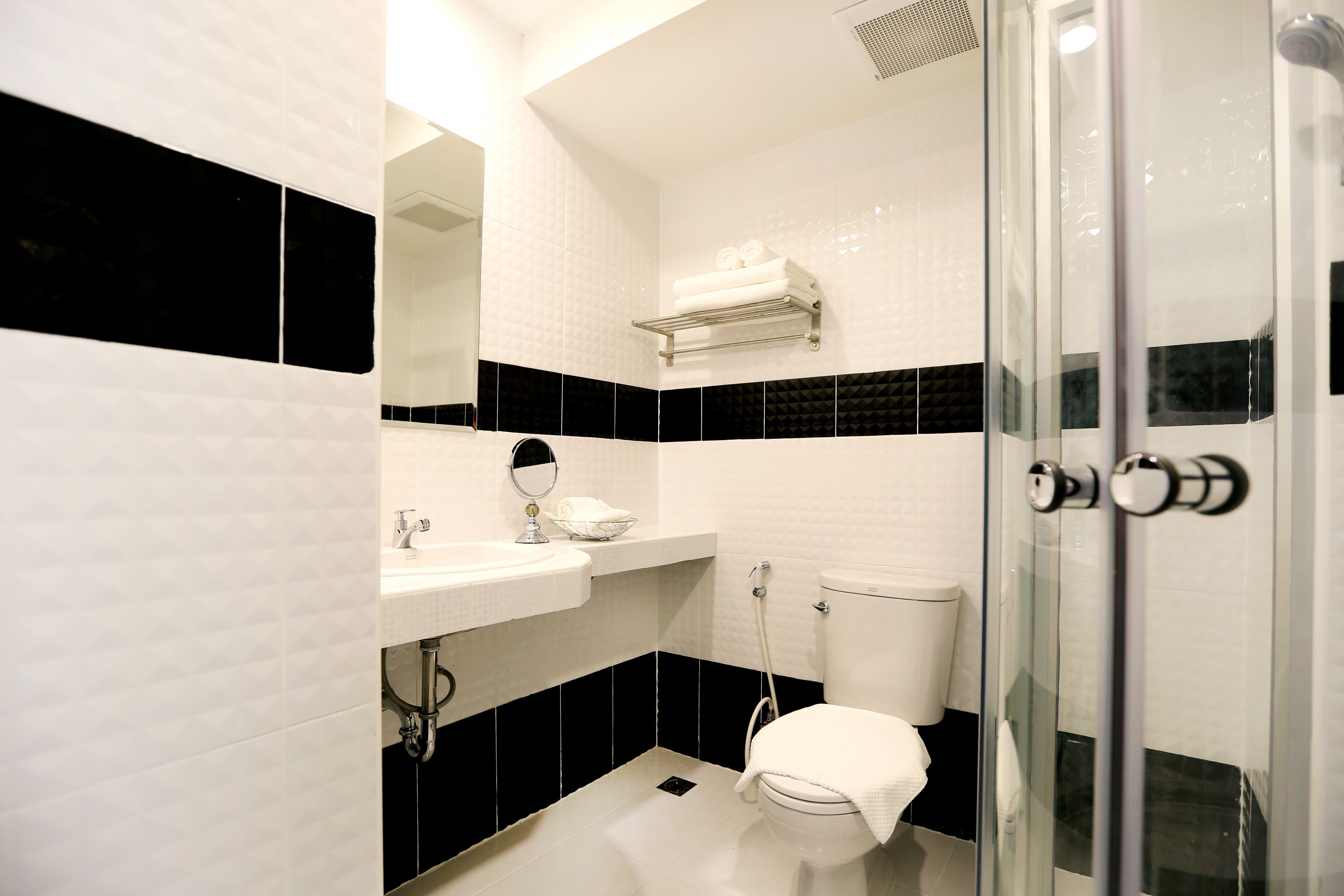 shower, rainfall showerhead, hair dryer, towels