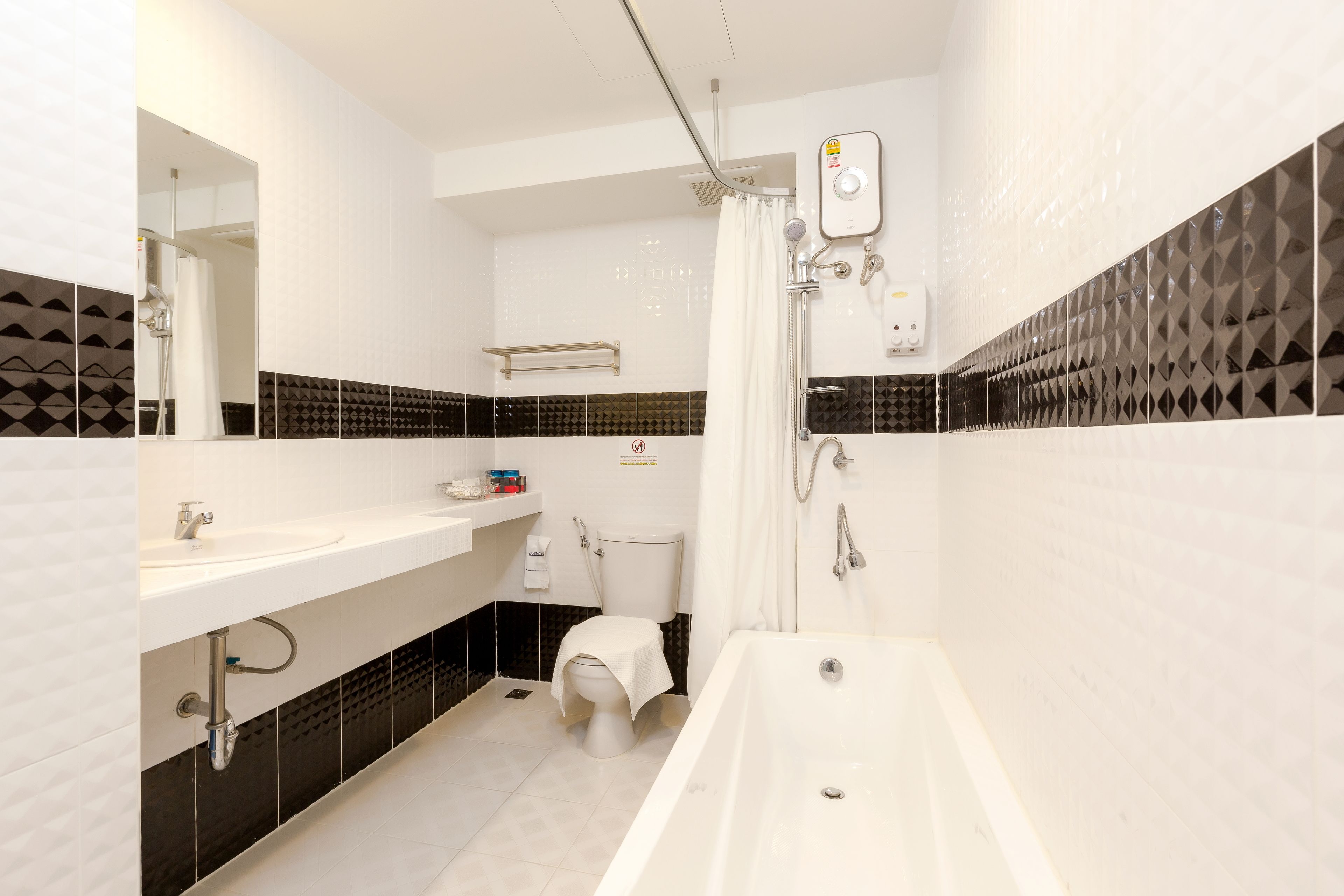 family suite room with bathtub | bathroom | shower, rainfall showerhead, hair dryer, towels