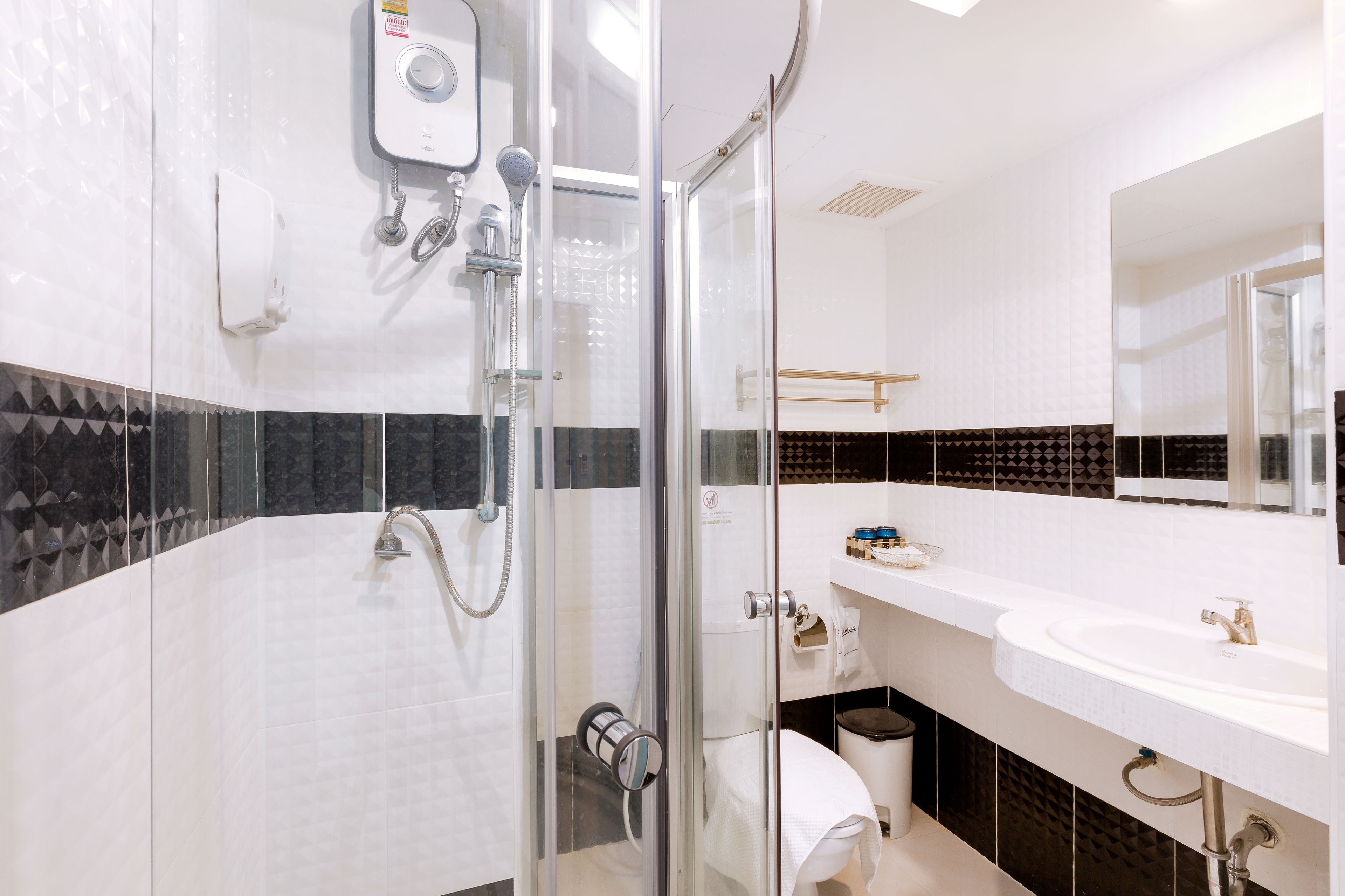 shower, rainfall showerhead, hair dryer, towels