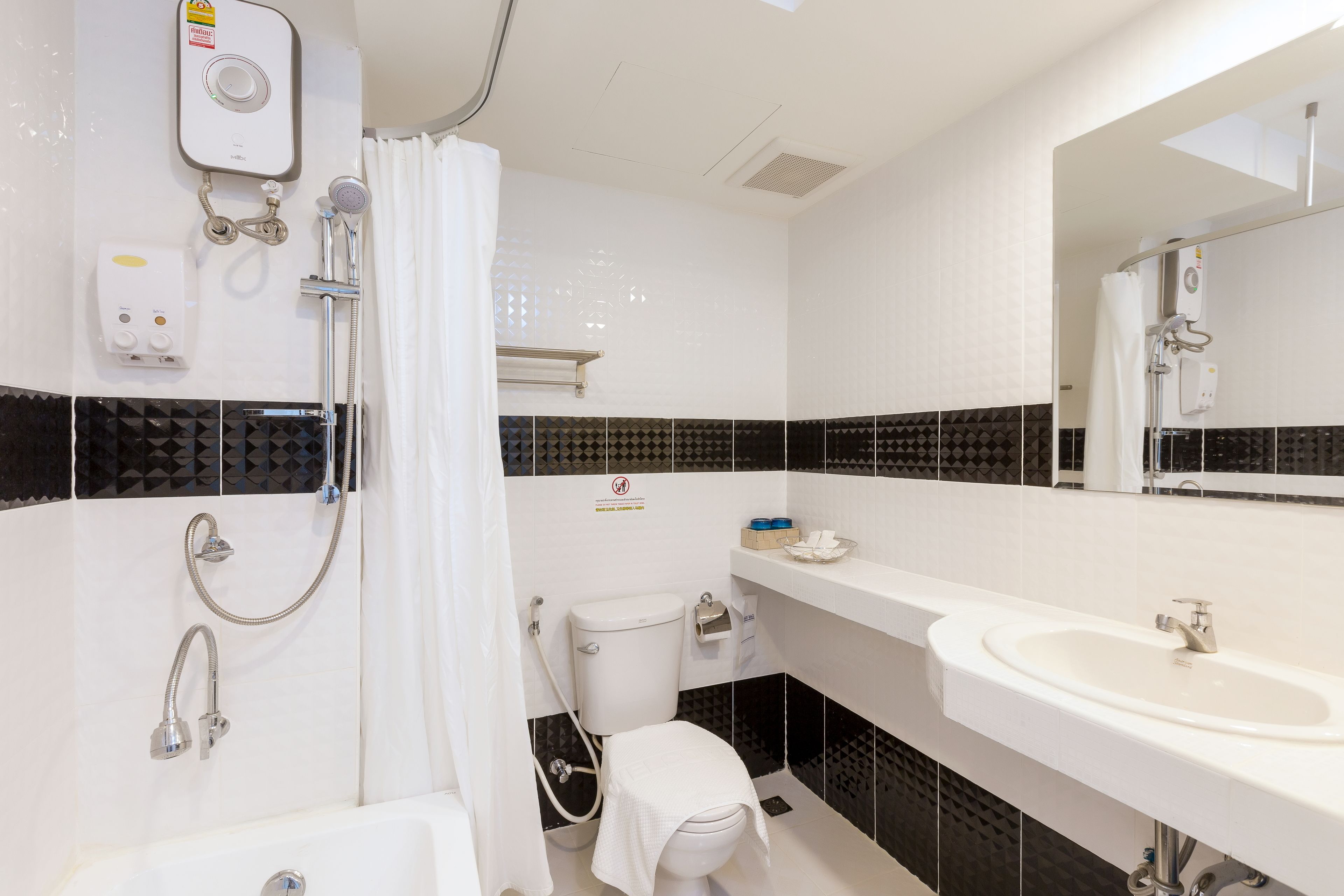 suite room with bathtub | bathroom | shower, rainfall showerhead, hair dryer, towels