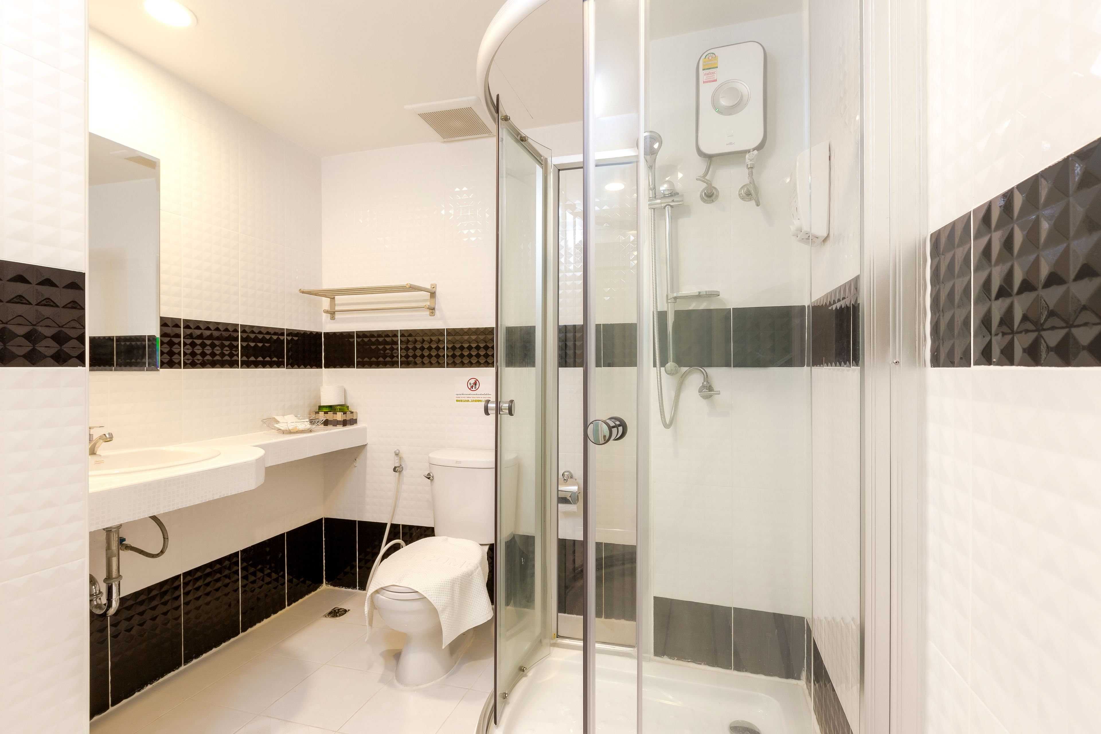deluxe double room | bathroom | shower, rainfall showerhead, hair dryer, towels