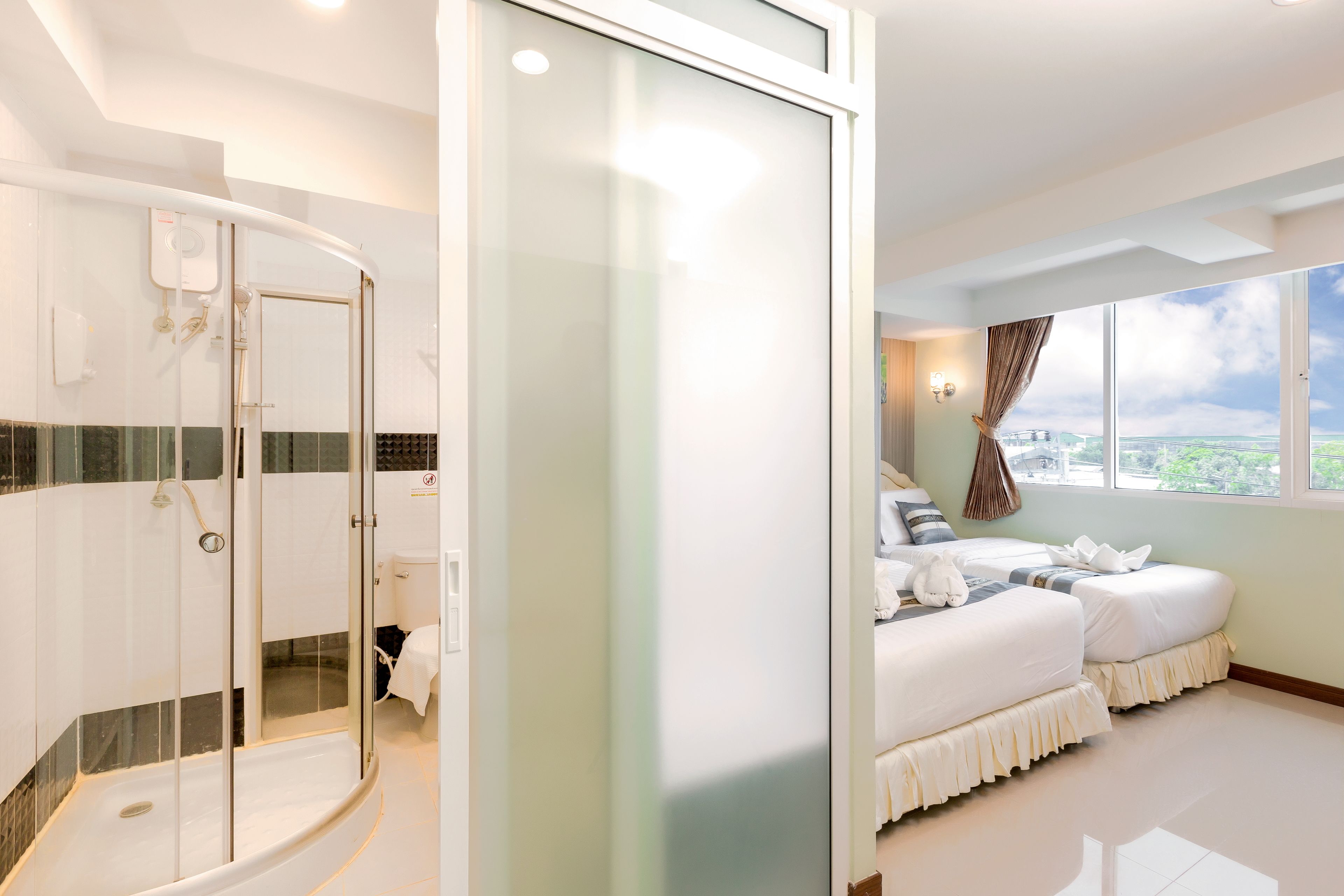 deluxe triple room | desk, laptop workspace, blackout curtains, free wifi