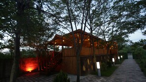 A wooden pavilion with a covered roof, surrounded by trees and a paved walkway. - Buyuk Anadolu Eregli Hotel (Karadeniz Eregli)