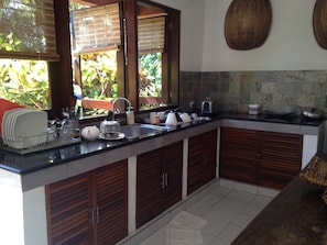 Full-sized fridge, microwave, stovetop, coffee/tea maker