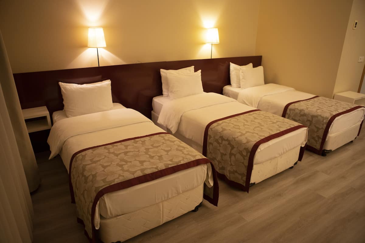 family triple room | premium bedding, desk, soundproofing, free wifi