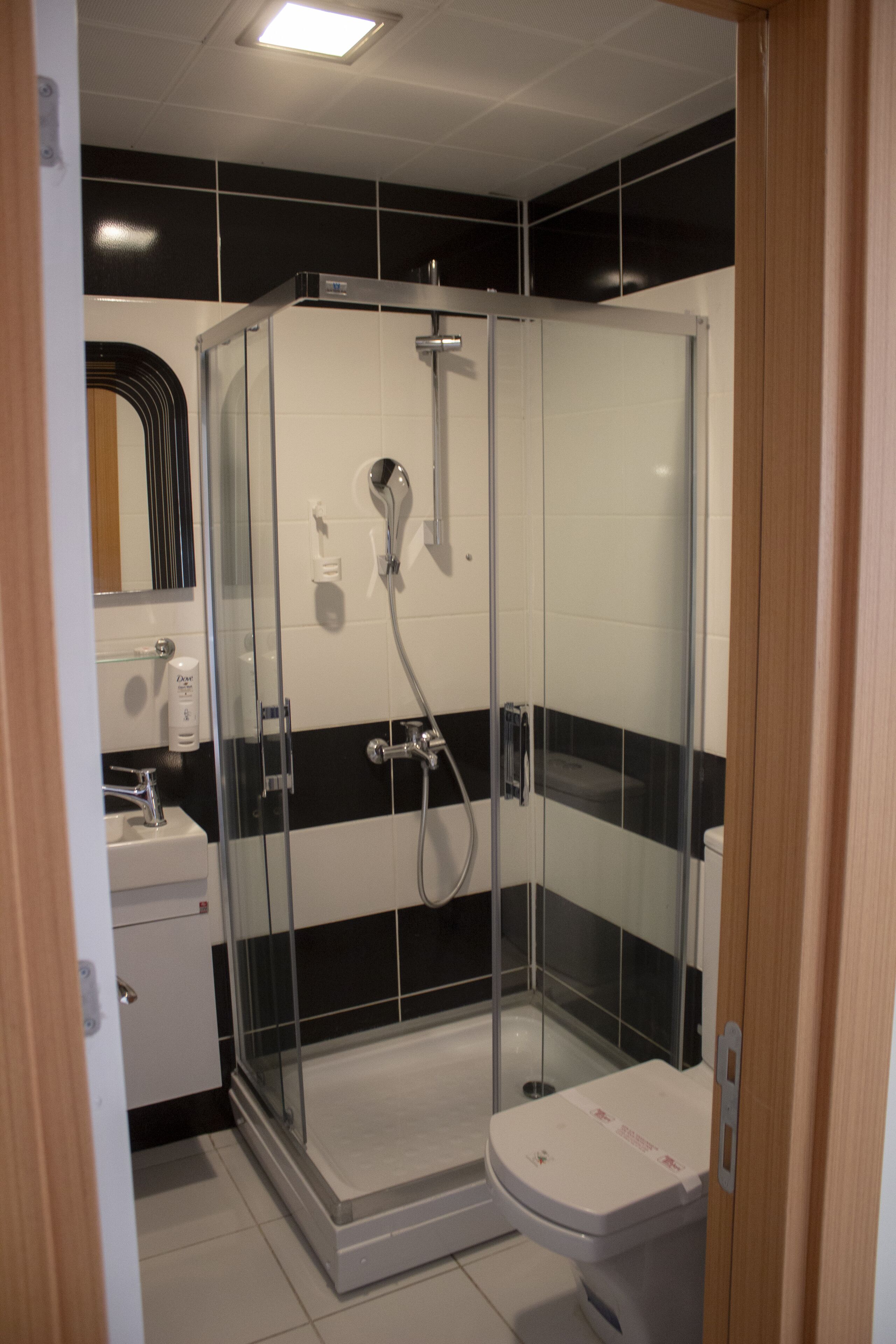 economy loft room | bathroom | shower, free toiletries, hair dryer, slippers