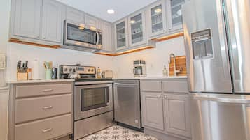 Condo (Newly Renovated Bright and Spacious C) | Private kitchen | Full-sized fridge, microwave, coffee/tea maker, cookware/dishes/utensils