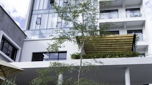 A modern hotel building with a sign reading "LOVE IT Signature Hotel 2076". - Hotel Love It CAS Consulate (Guadalajara)