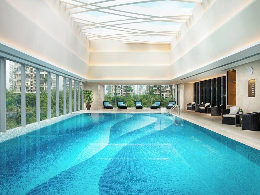 Indoor pool, open 7:00 AM to 10:00 PM, pool loungers