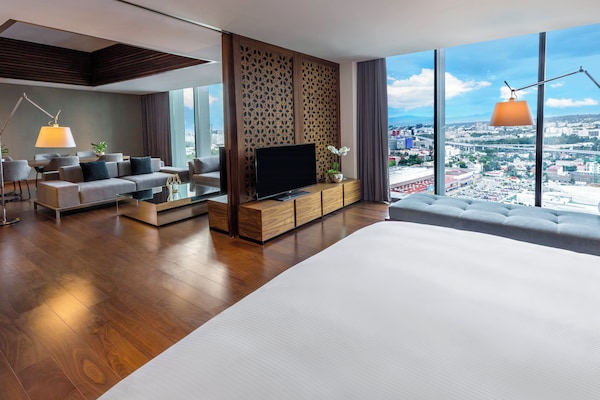 Premium bedding, down comforters, pillowtop beds, minibar