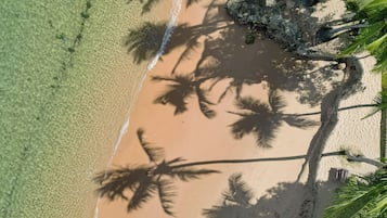 On the beach, sun-loungers, beach bar