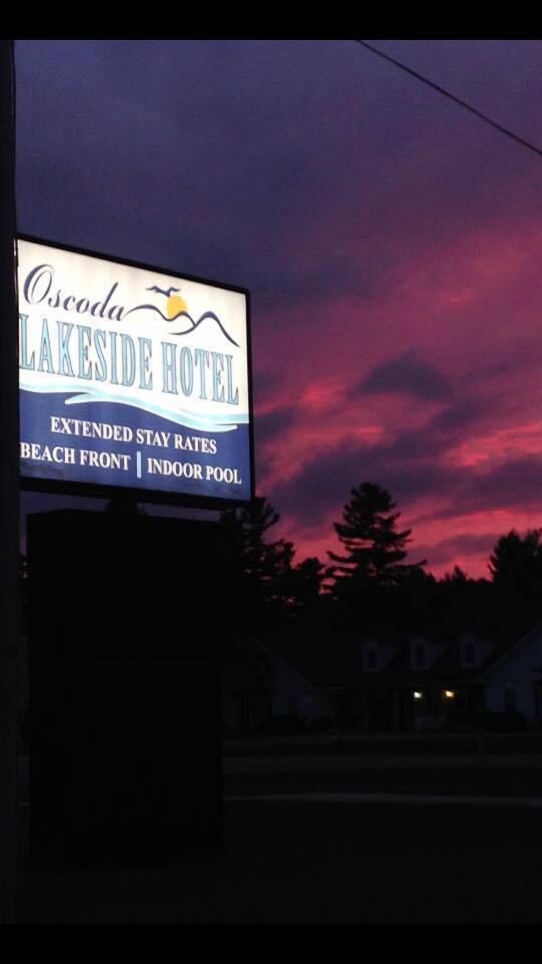 A sign for the Lakeside Hotel advertising extended stay rates, beach front, and indoor pool.