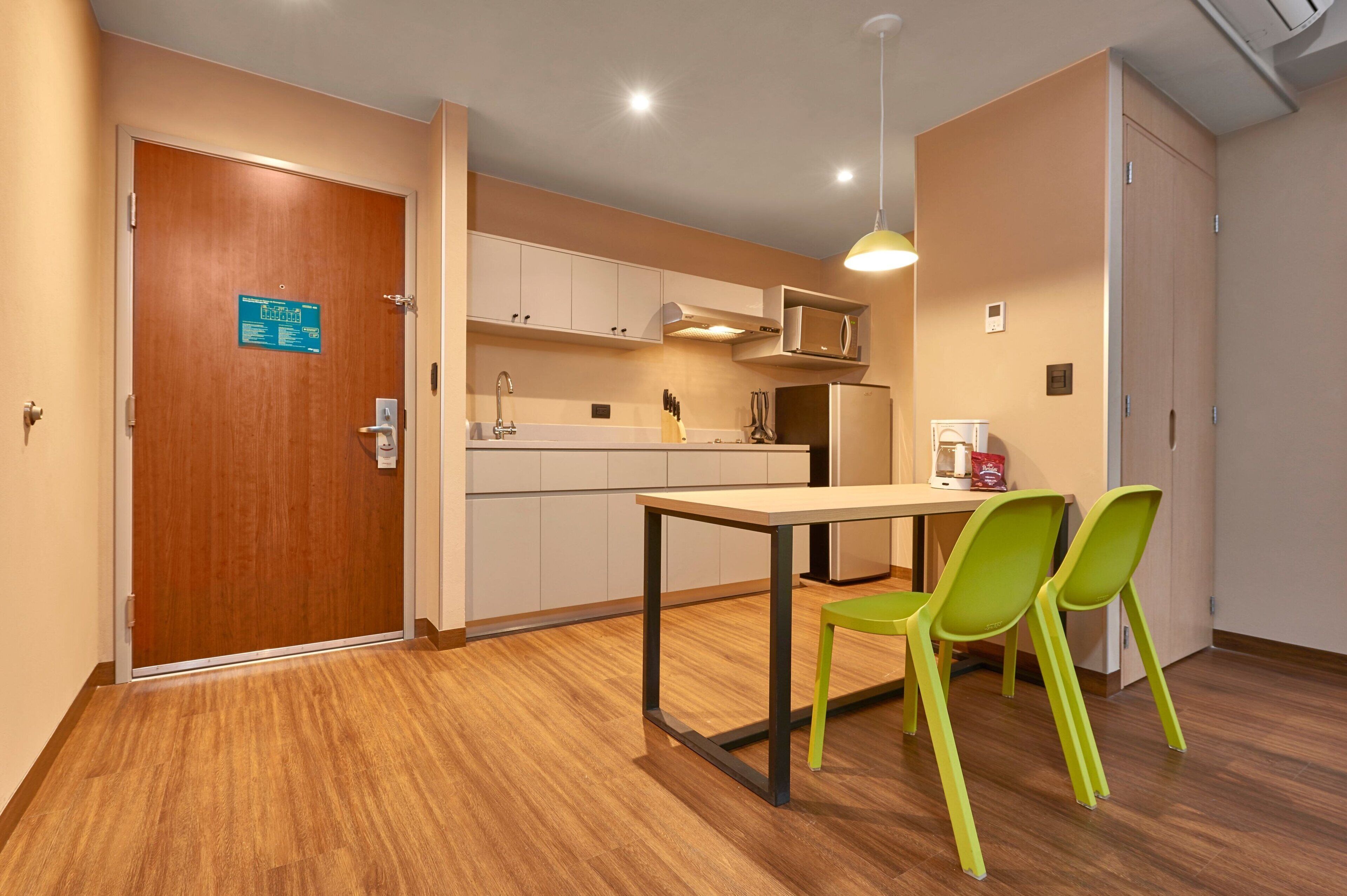 full-sized fridge, microwave, stovetop, coffee/tea maker