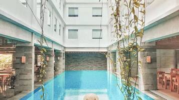 Outdoor pool, open 6:00 AM to 9 PM, pool loungers