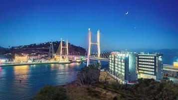 Experience the waterfront views from THE HOTEL SOO, where a glass facade offers stunning views of the surrounding area.